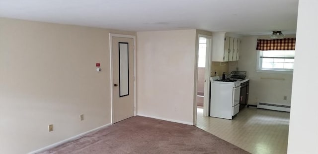 kitchen featuring white cabinetry, light colored carpet, white range with gas cooktop, and a baseboard heating unit