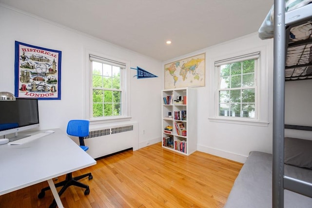 51 Rustlewood Rd, Milton, MA 02186 - home office with radiator heating unit, ornamental molding, plenty of natural light, light wood finished floors, and baseboards