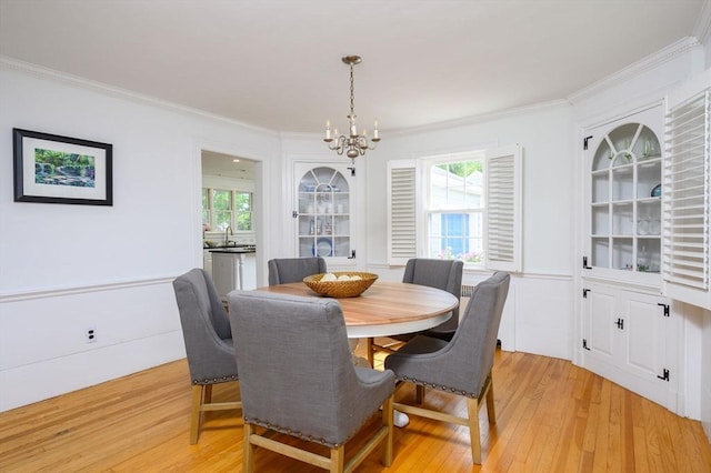 51 Rustlewood Rd, Milton, MA 02186 - dining room with a chandelier, light wood-style flooring, crown molding, and plenty of natural light