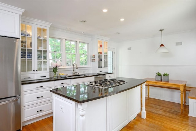 51 Rustlewood Rd, Milton, MA 02186 - kitchen featuring stainless steel appliances, a sink, white cabinets, crown molding, and recessed lighting