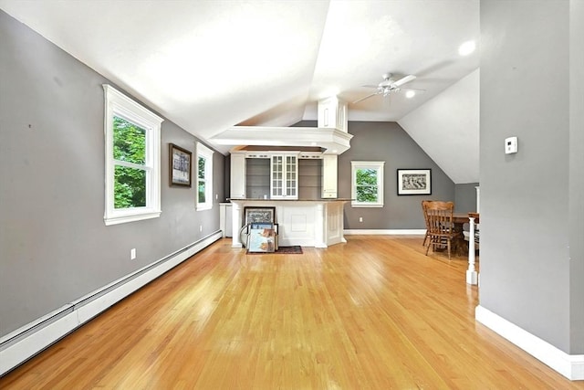 1095 Main St, Hanover, MA 02339 - unfurnished living room with baseboard heating, light wood-type flooring, ceiling fan, and lofted ceiling