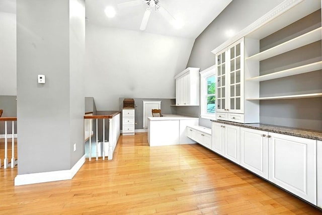 1095 Main St, Hanover, MA 02339 - kitchen with open shelves, a ceiling fan, light wood-type flooring, lofted ceiling, and white cabinets