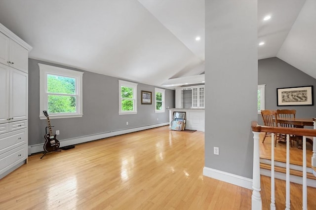1095 Main St, Hanover, MA 02339 - living room with vaulted ceiling, light wood-style flooring, a baseboard radiator, and recessed lighting