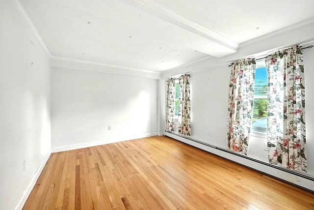 1095 Main St, Hanover, MA 02339 - empty room with baseboard heating, wood finished floors, and crown molding