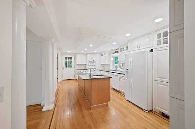 1095 Main St, Hanover, MA 02339 - kitchen with white appliances, healthy amount of natural light, ornamental molding, light wood-type flooring, and white cabinetry