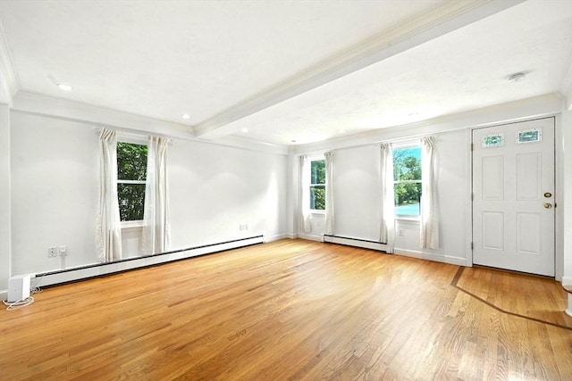 1095 Main St, Hanover, MA 02339 - empty room featuring baseboard heating, wood finished floors, plenty of natural light, crown molding, and beam ceiling