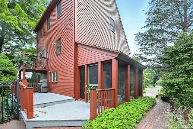 1095 Main St, Hanover, MA 02339 - view of home's exterior with a sunroom and a deck