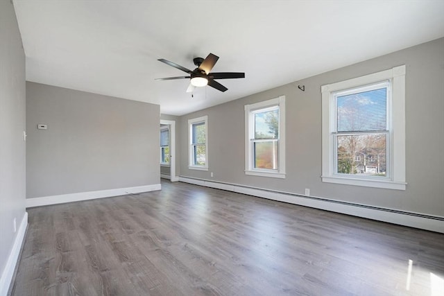 365 Middle Rd, Acushnet, MA 02743 - empty room featuring baseboards, baseboard heating, ceiling fan, and wood finished floors