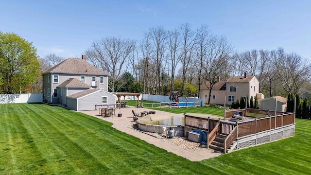 365 Middle Rd, Acushnet, MA 02743 - view of yard with fence, a shed, a deck, an outbuilding, and a patio