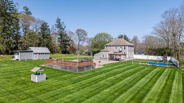 365 Middle Rd, Acushnet, MA 02743 - view of yard featuring an outdoor structure, fence, a pergola, and a deck