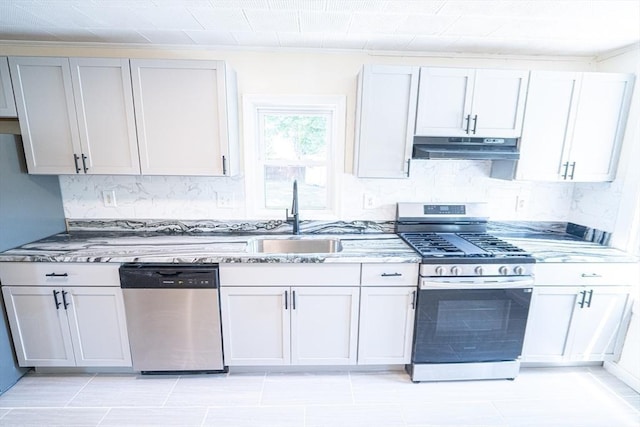 73 Sladen St, Dracut, MA 01826 - kitchen featuring stainless steel appliances, under cabinet range hood, decorative backsplash, light stone countertops, and ornamental molding