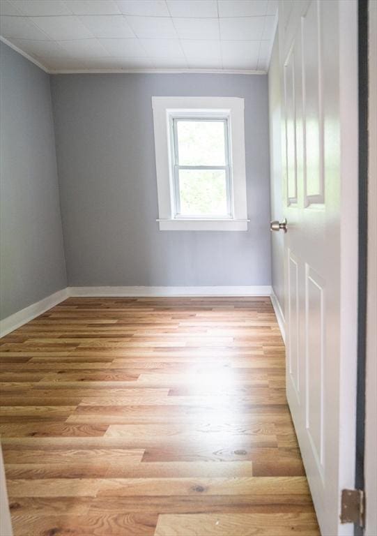 73 Sladen St, Dracut, MA 01826 - unfurnished room with ornamental molding and light wood finished floors