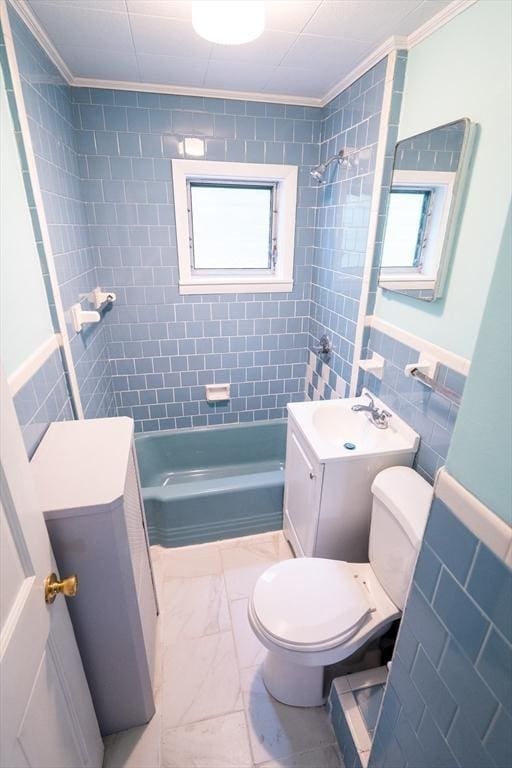 73 Sladen St, Dracut, MA 01826 - full bath featuring shower / tub combination, marble finish flooring, ornamental molding, vanity, and tile walls