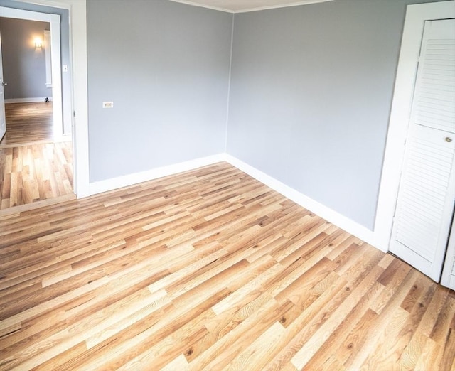73 Sladen St, Dracut, MA 01826 - empty room featuring light wood-style floors and crown molding