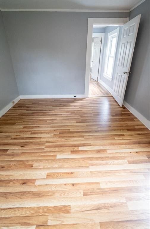 73 Sladen St, Dracut, MA 01826 - empty room with light wood-style floors and crown molding