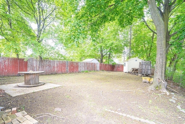 73 Sladen St, Dracut, MA 01826 - fenced backyard with a storage unit