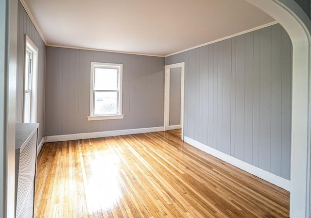 73 Sladen St, Dracut, MA 01826 - spare room featuring hardwood / wood-style floors, crown molding, arched walkways, and radiator
