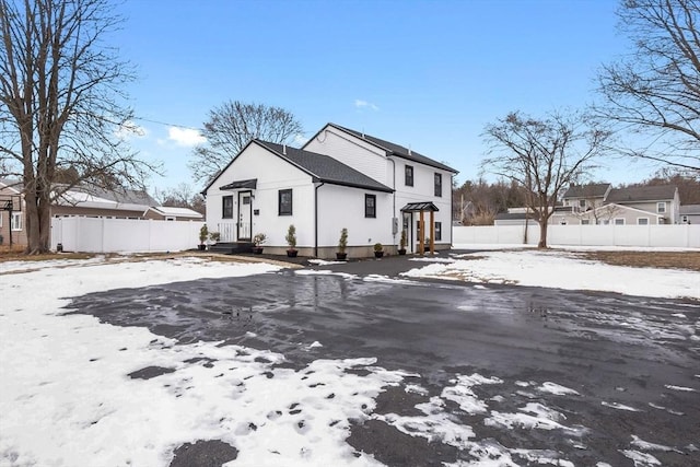 view of snow covered house