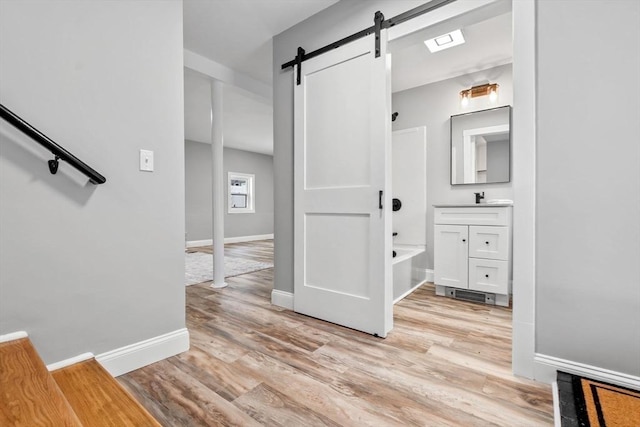 bathroom with vanity,  shower combination, and wood-type flooring