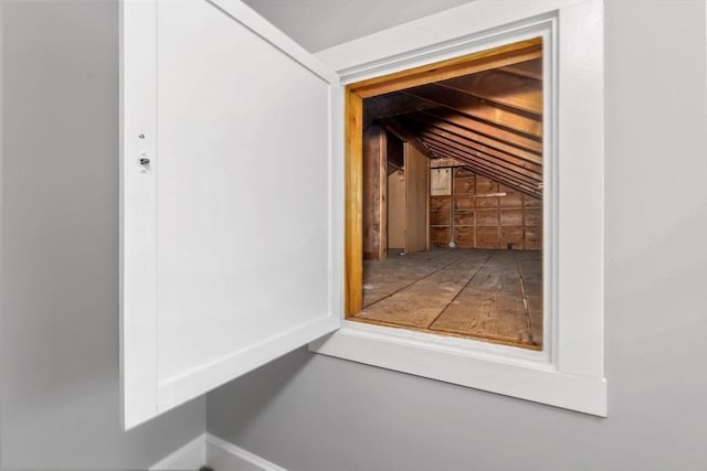 doorway to outside with lofted ceiling