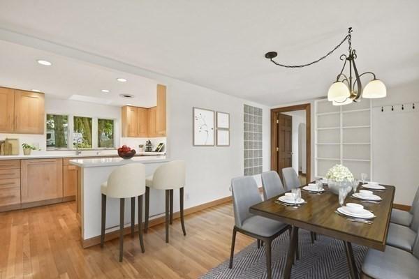 dining area with baseboards, recessed lighting, and light wood finished floors