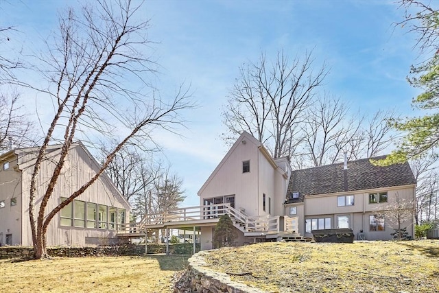 view of side of property featuring a deck and stairs