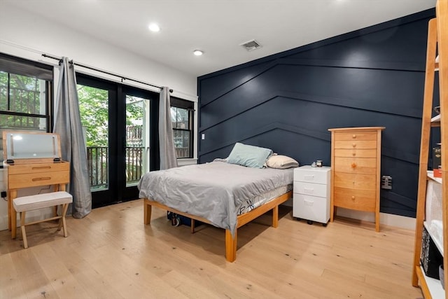 331 Chelsea St Unit 1, Boston, MA 02128 - bedroom with access to outside, light wood-style floors, and recessed lighting