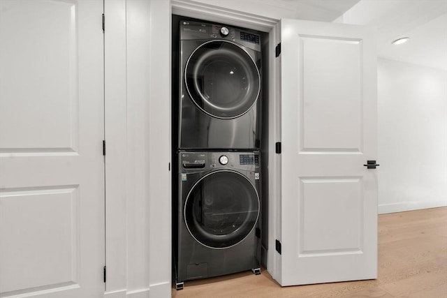 331 Chelsea St Unit 1, Boston, MA 02128 - laundry room featuring stacked washer / drying machine and light wood finished floors