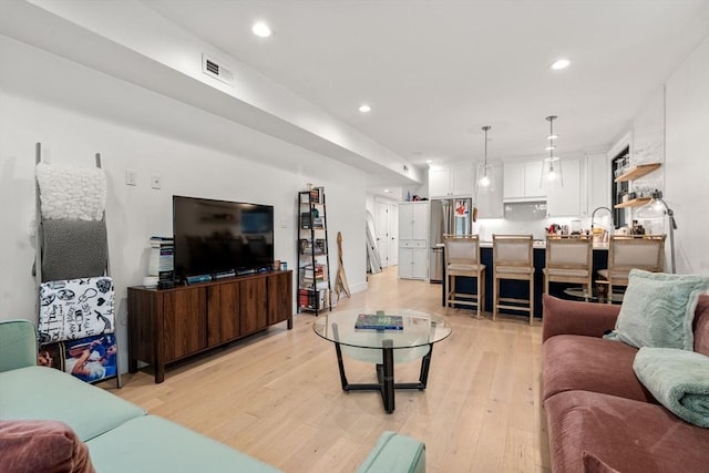 331 Chelsea St Unit 1, Boston, MA 02128 - living area with light wood finished floors and recessed lighting