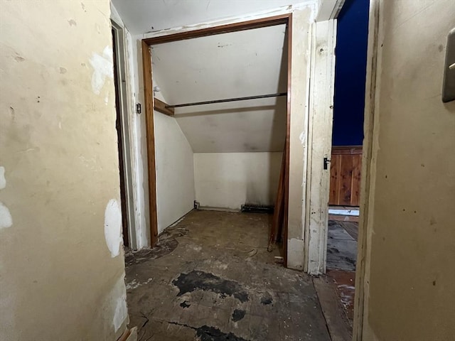 hallway featuring vaulted ceiling