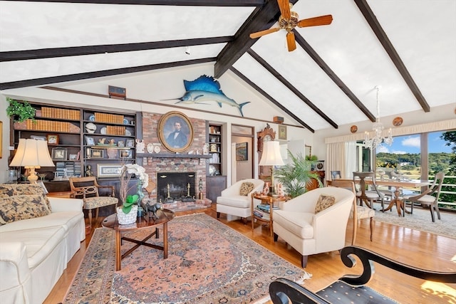 living room featuring high vaulted ceiling, ceiling fan with notable chandelier, a fireplace, wood-type flooring, and beam ceiling