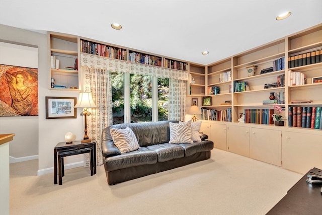 living area with light carpet