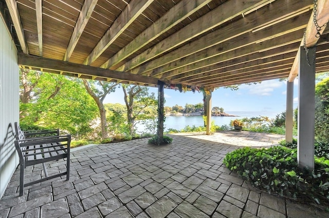 view of patio with a water view