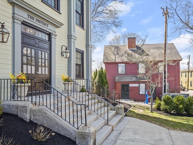 entrance to property with a chimney
