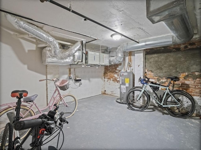 unfinished basement featuring electric water heater