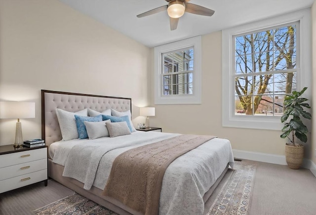 bedroom with baseboards, a ceiling fan, and carpet floors