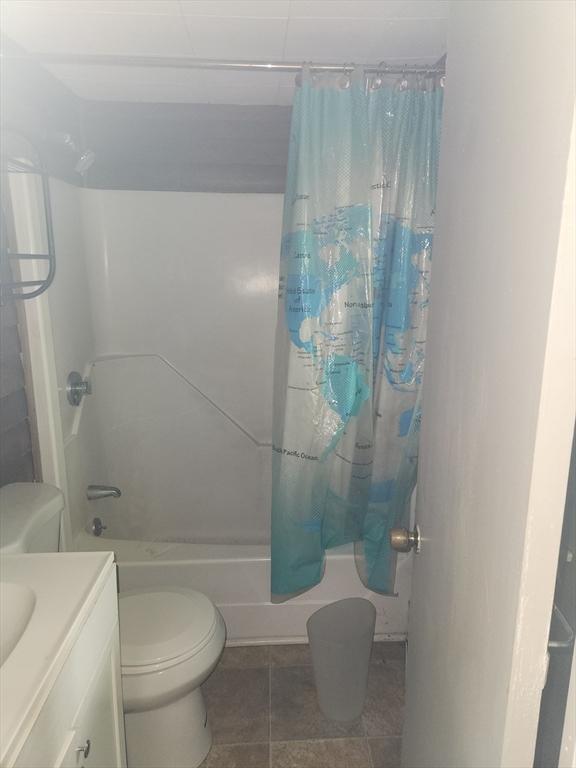 35 Hillcrest St, Waltham, MA 02451 - full bathroom with shower / bath combo with shower curtain, vanity, and tile patterned floors
