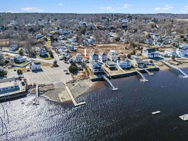 birds eye view of property with a residential view and a water view