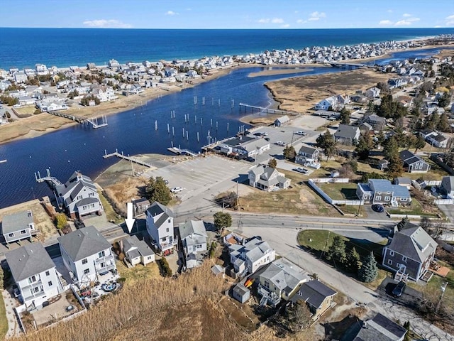 bird's eye view featuring a water view and a residential view