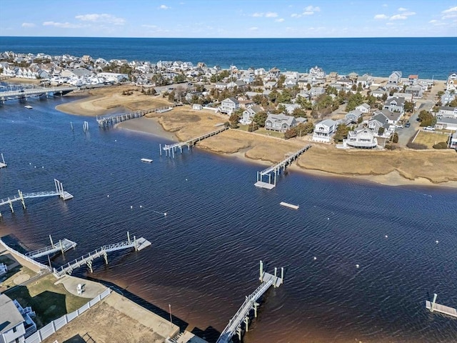 bird's eye view with a residential view and a water view