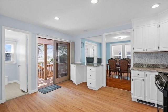 interior space with visible vents, recessed lighting, baseboards, and light wood-type flooring