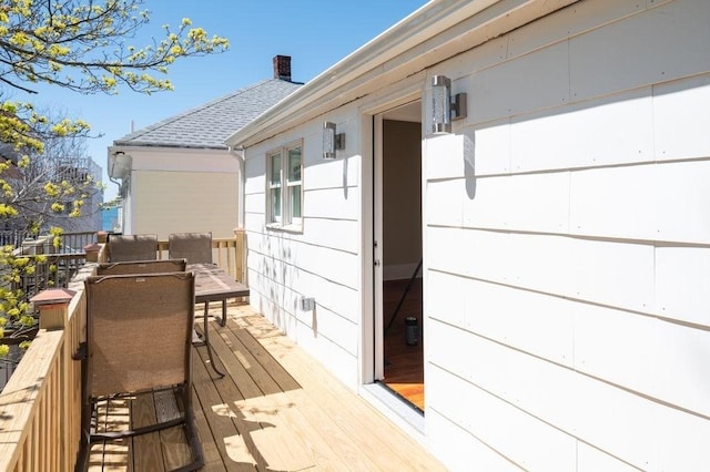 wooden terrace featuring outdoor dining space