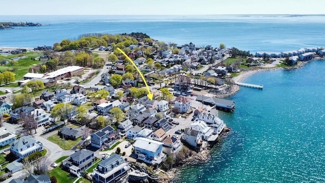 drone / aerial view featuring a residential view and a water view