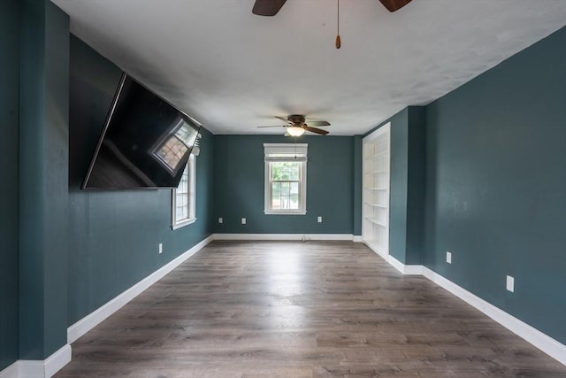 263 Jefferson Ave, Salem, MA 01970 - spare room with ceiling fan, built in features, and wood finished floors