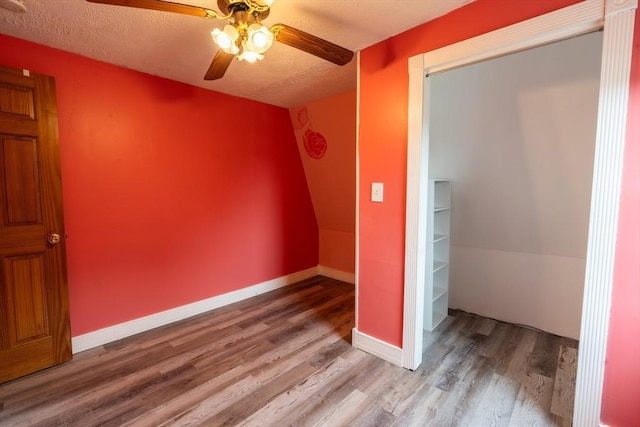 263 Jefferson Ave, Salem, MA 01970 - unfurnished bedroom with wood finished floors, a textured ceiling, and a ceiling fan