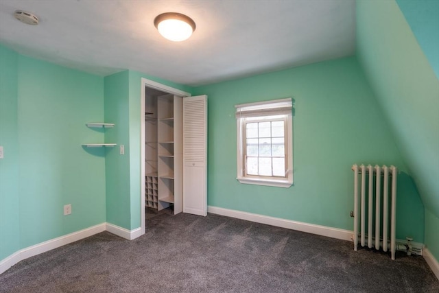 263 Jefferson Ave, Salem, MA 01970 - unfurnished bedroom with radiator, dark carpet, and a closet