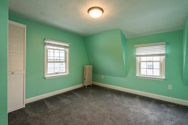 263 Jefferson Ave, Salem, MA 01970 - unfurnished bedroom featuring radiator, multiple windows, and dark colored carpet