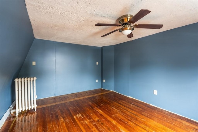 263 Jefferson Ave, Salem, MA 01970 - empty room with radiator, hardwood / wood-style flooring, ceiling fan, and a textured ceiling