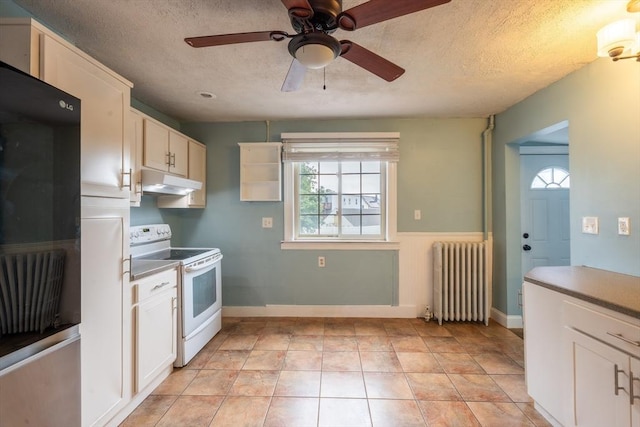 263 Jefferson Ave, Salem, MA 01970 - kitchen with radiator, white electric range, under cabinet range hood, ceiling fan, and a textured ceiling