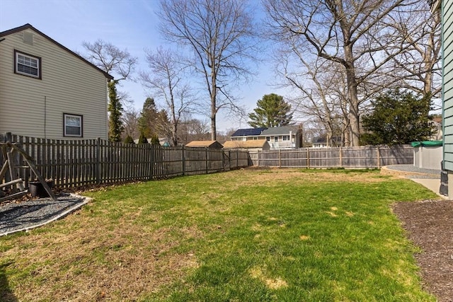 view of yard with a fenced backyard
